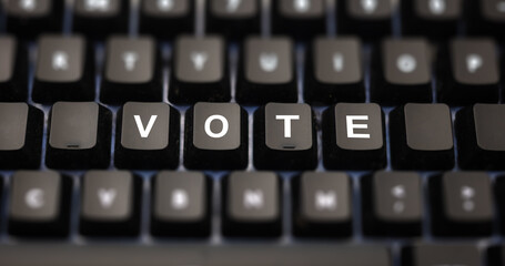 Online voting concept. Vote text written on keypad. Black keys with white letters message for...