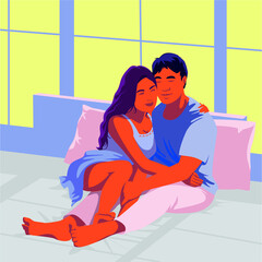 Beautiful loving couple kissing in bed