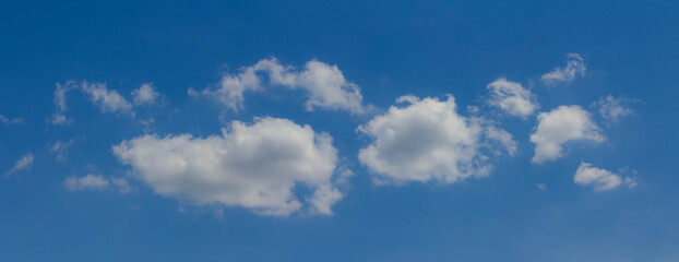 Fototapeta premium Beautiful blue skies with white fluffy clouds in the daytime. Panoramic view.