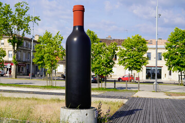 big giant bottle of wine on the pauillac quays