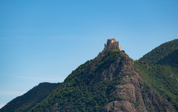 View of the Abbey of San Michele della Chiusa,Piedmont, Italy. Footage from the mountain on the opposite side of the valley, this abbey perched at the top of the peak has an imposing appearance.