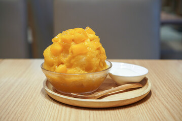 Mango Kakigori, Japanese shaved ice with mango syrup and fresh dice mango served with milk panna cotta. (center)