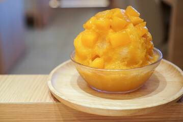 Mango Kakigori, Japanese shaved ice with mango syrup and fresh dice mango. (isolated)