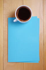 Obraz na płótnie Canvas Coffee and blue paper