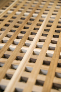 brown wooden lattice textured background. Close up with copy space