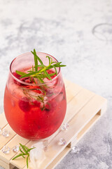 Summer refreshing cocktails made of rose wine or gin with raspberries and rosemary.