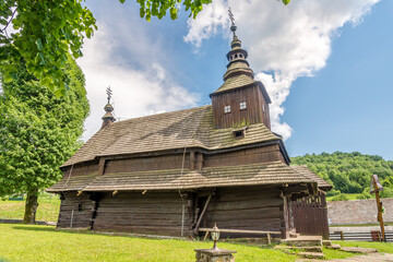 Fototapeta na wymiar View at the Wooden Church of Saint Michael Archangel in village Topola, Slovakia