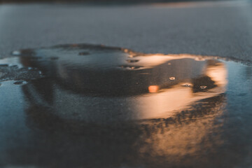 Reflection of the mercedes benz museum in a puddle in stuttgart south of germany