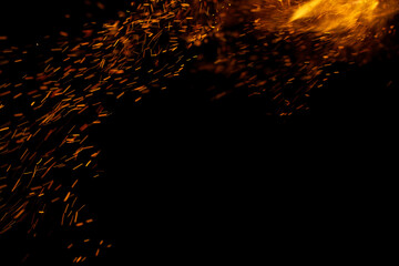 flame of fire with sparks on a black background