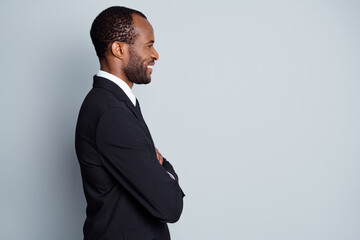 Profile side view portrait of his he nice attractive imposing classy cheerful guy investor recruiter wearing suit folded arms career development isolated over grey pastel color background - Powered by Adobe