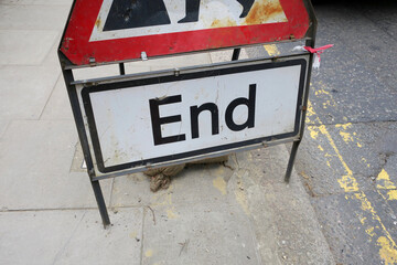 end, traffic sign place on the sidewalk near the street