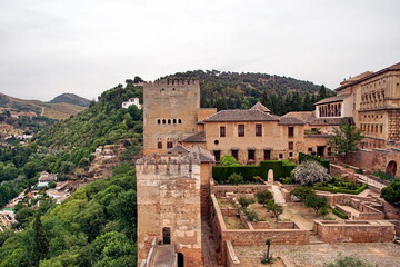 Fototapeta premium Alhambra or Red Castle in Granada spanish city, located on top of hill al-Sabika. Moorish palace fortress complex in Andalusia, Spain