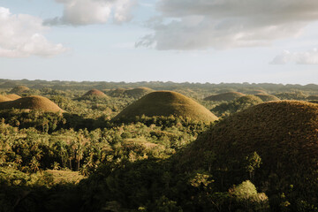view from the viewpoint of the chocolate hills on a sunny afternoon