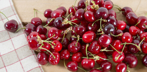 bunch of cherries on the wooden table