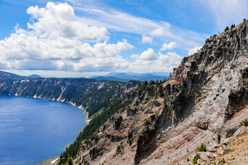 Fototapeta na wymiar Rim of Crater Lake National Park. Beautiful Nature in Summer Season Famous Tourist Attractions in Oregon State, USA.