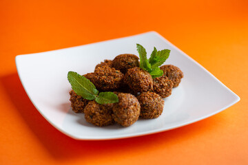 Falafel , middle eastern deep fried chickpea balls with french fries 