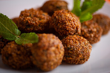 Falafel , middle eastern deep fried chickpea balls with french fries 