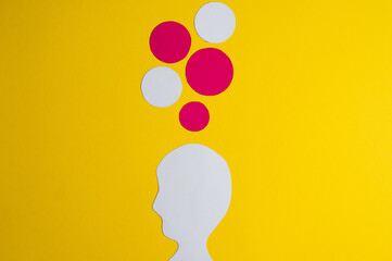 silhouettes of a head, on a green background. Dialogue, negotiations, and Collective planning.