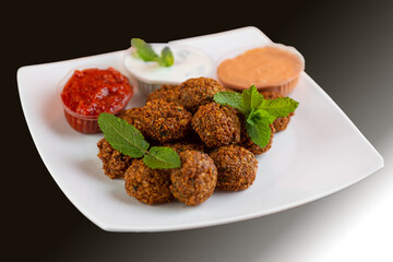 Falafel , middle eastern deep fried chickpea balls with french fries 