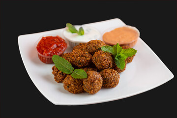 Falafel , middle eastern deep fried chickpea balls with french fries 