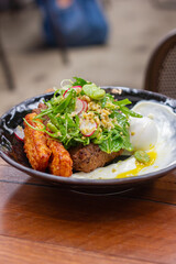 Zucchini fritters with salad and labne