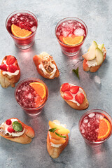 Fruit bruschetta with summer drink top view Delicious appetizer snack Party time concept