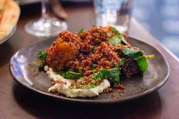 Pumpkin, hummus and spinach salad