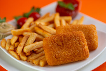 Roasted breaded  cheese with tomato sauce  french fries.