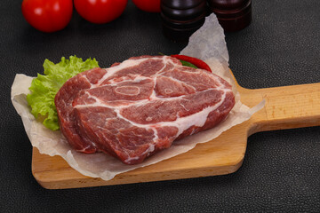 Raw pork neck steak