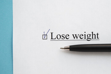 a piece of paper with the inscription lose weight from to do list with a tick 