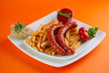 Sausage and french fries meal.