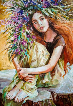 Beautiful young forest nymph in a large wreath of purple wildflowers sits on an old stump,with a yellow field in the background. Oil painting