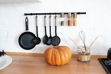 autumn pumpkin in the kitchen on the table