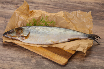 Salted herring over the wooden board