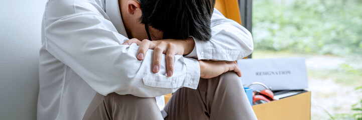 Images of packing up all his personal belongings and files into a brown cardboard box, Businessman...