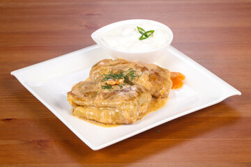 Homemade stuffed cabbage with cream