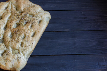 focaccia dough in a baking dish. Traditional Italian Focaccia with rosemary