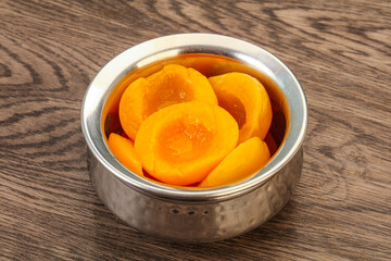 Marinated peaches fruit in the bowl