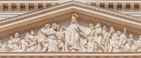 Panoramic view of bas relief sculptures of Biblical scene at the main portal of Evangelical church...