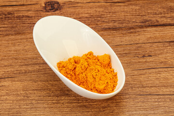 Tumeric powder in the bowl
