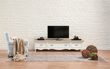 Decorative white classic television unit and brick wall background.