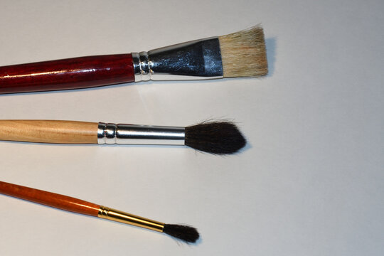 paint brushes on a white background