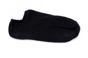 A pair of black unisex short socks on a white background. Black sports short socks in macro. Sweet socks