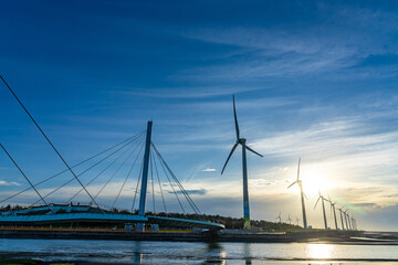 Gaomei Wetlands Area wind turbines in sunset time, a flat land which spans over 300 hectares, also a popular scenic spots in Qingshui District, Taichung City, Taiwan