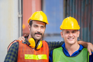 Happiness and smiling engineer and worker man standing with hands on shoulders and looking at camera