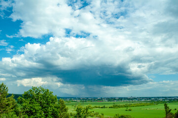 green field and blue sky