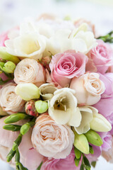 Closeup of a bouquet of flowers consisting of geraniums, carnations, roses in bright wedding colors