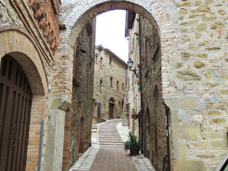 Fototapeta na wymiar Characteristic italian alley of the Medieval Castel Rigone that is a village located near Trasimeno Lake, Umbria.