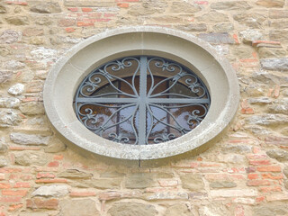 Fototapeta na wymiar Rose window of an Italian church.