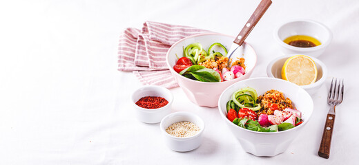Fresh salad with couscous, tomatoes, cucumber, radish and chard.
